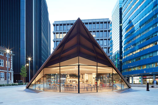 The structure is uplit at night so that the internal white soffit makes the pavilion glow.