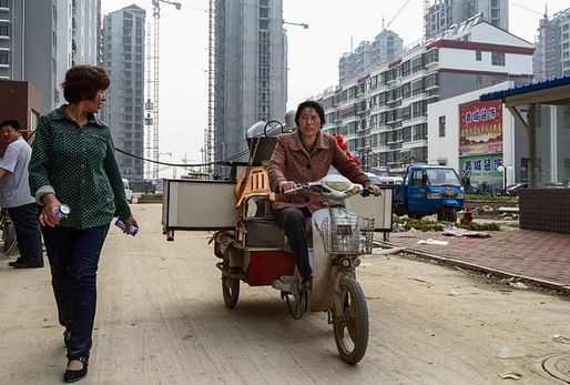 Chen Hua, 50, moving to her new home in Liaocheng. Her village house was bulldozed to make way for development. Credit: Justin Jin for The New York Times 