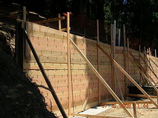 Forms at uphill retaining wall. 