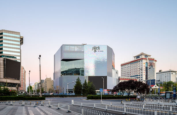 MVRDV was commissioned to design the building’s exterior and responded to these competing hopes with a 7-storey volume that rises to the maximum allowed height of 36 metres—an unusually tall building for this kind of mall. The shape of the building was generated by cutting the volume at various angles to orient the façades to face key locations, such as the railway station and an intersection on the other side of the street, generating a shape that is both contextual and recognizable in...