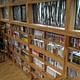 Bookcase and sunlight through the combination of glass and raw material