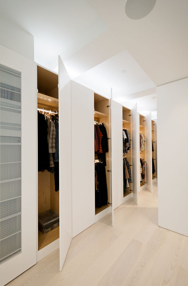 Wall-to-wall Full Height Built-Ins in the Master Suite Provide Efficient Storage