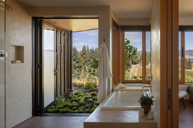 The main bathroom shower opens completely to the outdoors, sheltered by the wood screen. PHOTOGRAPHER: Andrew Pogue