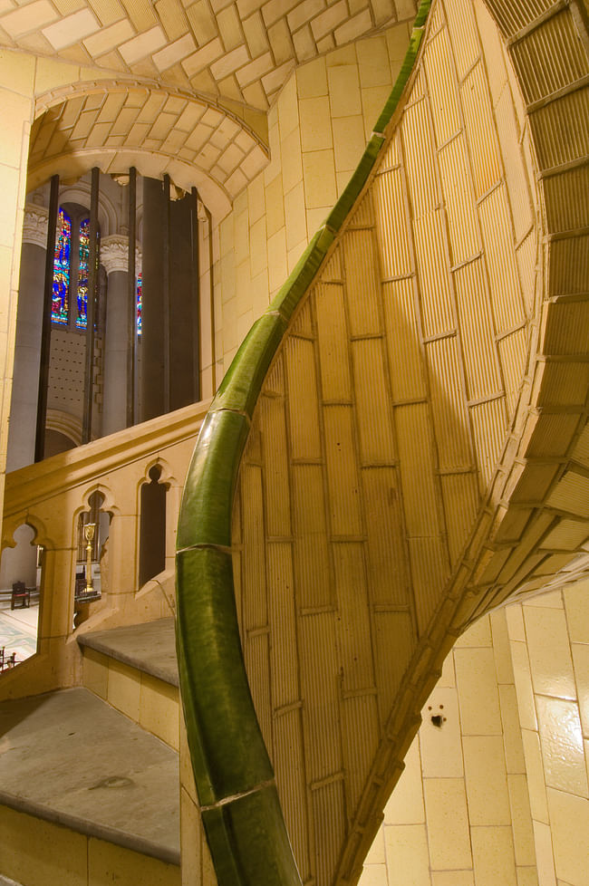 This angle of the spiral stair at the Cathedral of Saint John the Divine (begun 1892) in Manhattan demonstrates the spatial and structural complexities of some of the Guastavino tile vaults. The brilliance of the Guastavino system lies in the seamless integration of structure and finished surface. Each layer of tiles was offset from the adjacent layer to create an interlocking pattern, reminiscent of a woven basket. Such patterns help to distribute forces evenly throughout the structure...