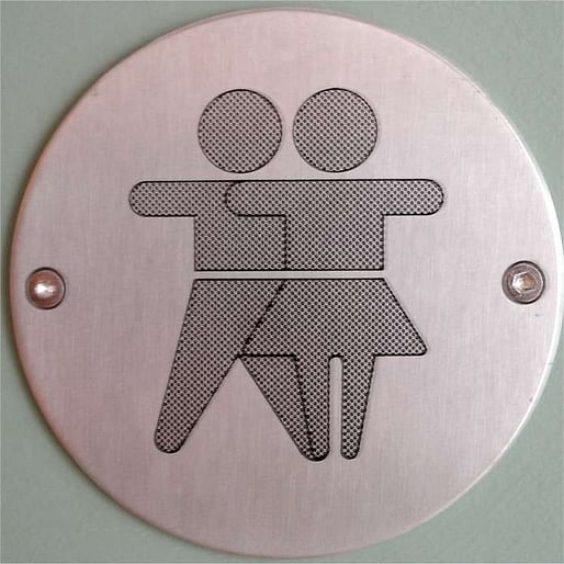 A unisex bathroom sign (image via flickr, Bart Maguire)