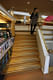The Regional Library of Lapland. Jennifer Wong on sunken reading room stairs.