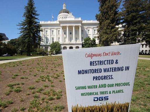 "Restricted & monitored watering in progress" at the California State Capitol in Sacramento. (Image via roam and shoot/Flickr)