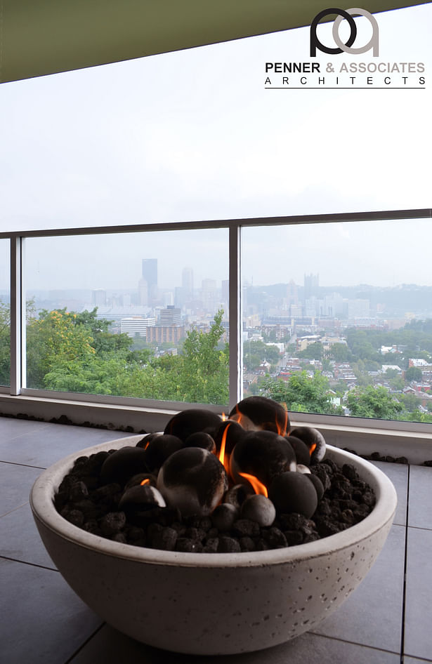 The family room on the basement floor opens with a large sliding door onto a huge patio; complete with an outdoor kitchen, dining, and gas firepit. Once again, glass guards maintain the incredible view. The decorative gas firepit is connected to a hard gas line to allow for easy use.