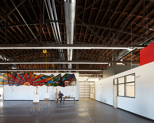 an open-studio floor plan was created to maximize space around a centralized gallery