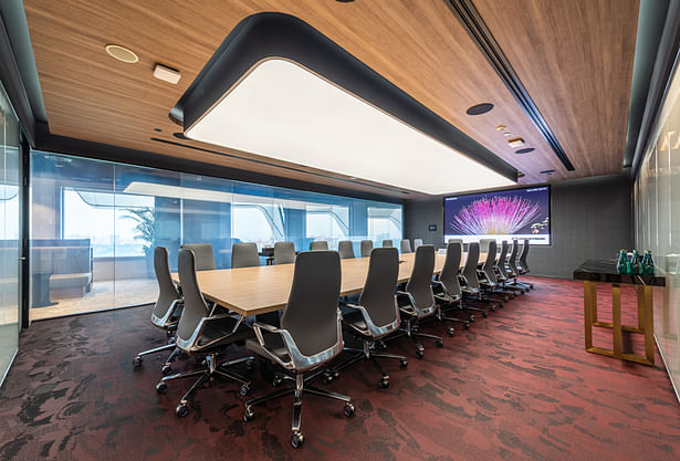 The boardroom features a dark timber ceiling which helps to optically enlarge the room, while providing a warm, luxurious, elegant and soft ambience, and a feature ceiling light.