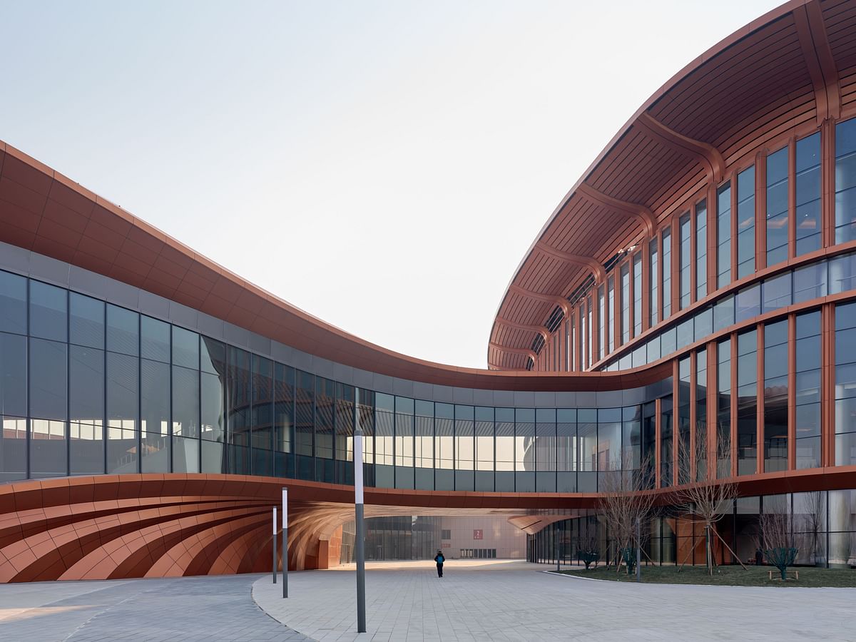 Copper-toned, sinuous exhibition center by Zaha Hadid Architects opens in Beijing