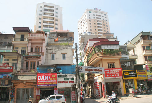 Apartment towers are popping up in Hanoi's network of small alleyways, causing major traffic, infrastructural problems and severe fire danger. (Image via vietnamnet.vn)