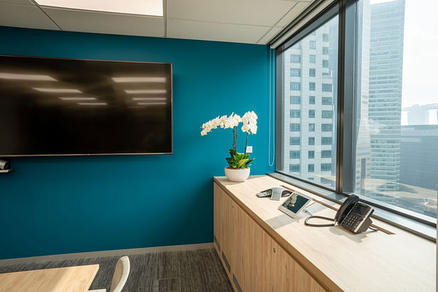 Forrester Singapore boardroom in dark green and teal by Space Matrix