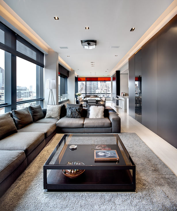 Living room featuring a TV unit from InterLubke, Minotti sofa, coffee table and console. 