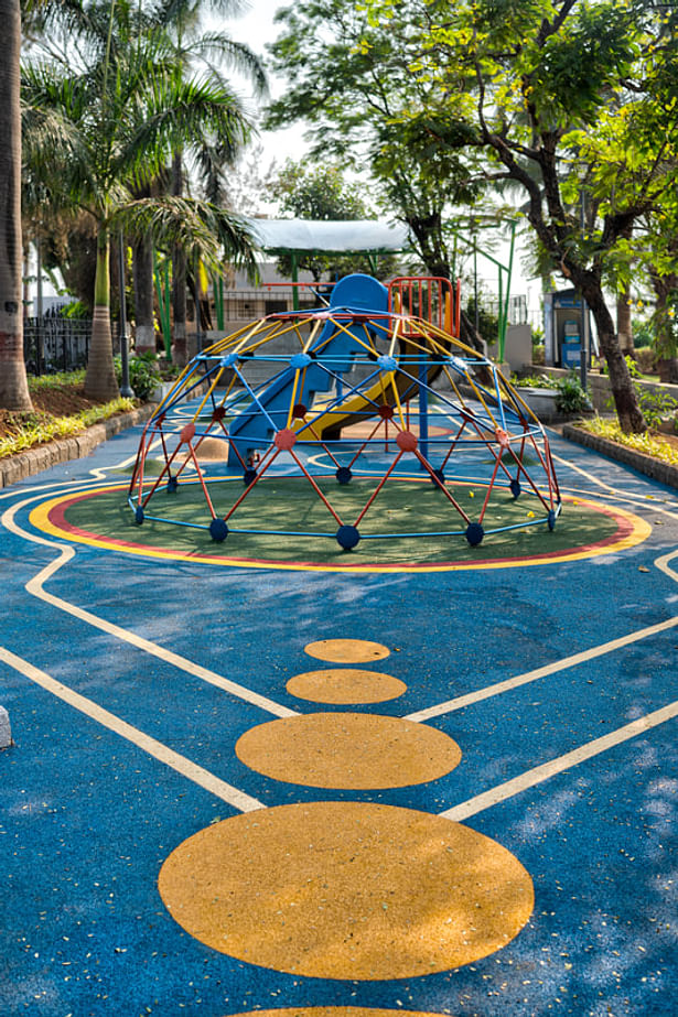 Colourful patterns on the flooring of the play area liven up the space.