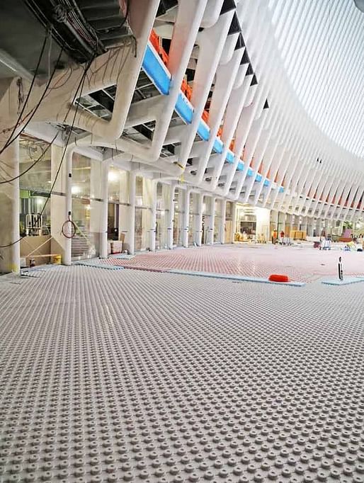Photo of the floor installation inside the World Trade Center Transportation Hub. (Image via "WTC Progress" Facebook page)