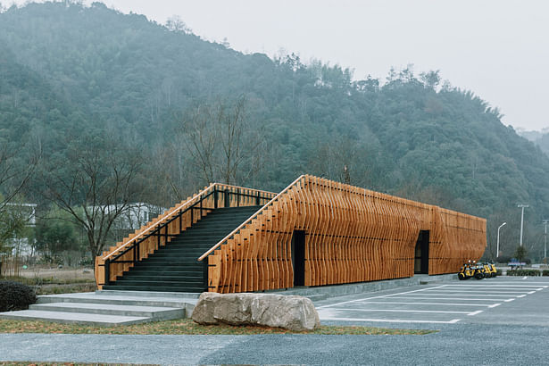 View of the centre from the southeast. The staircases placed on either end of the building allow it to be continuous with the ground plane enabling easy roof access.