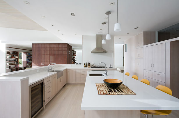 The kitchen is meant to be minimal, almost like furniture, and a long island also acts as an informal eating area.