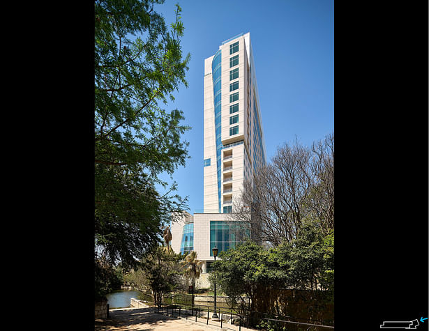 Side view of the Thompson San Antonio and Arts Residences at the Thompson Hotel on the San Antonio River Walk.