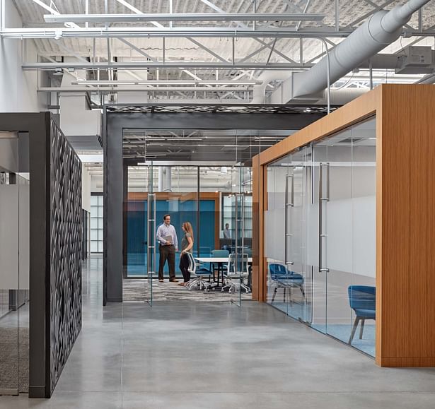 Creation of glass and roofed “boxes” within the larger envelope contribute to the open, light-filled environment, giving employees additional collaborative and huddle spaces.