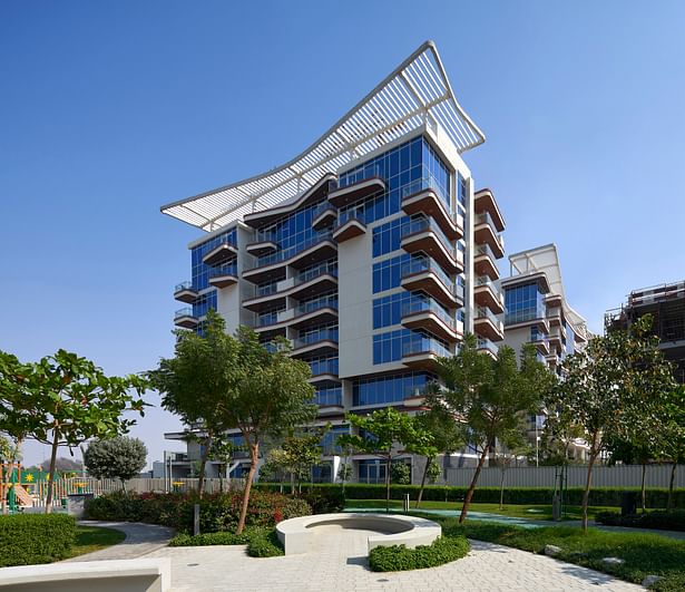 Exterior side view of the Residential Building with landscaped gardens, providing a calm atmosphere to the residents