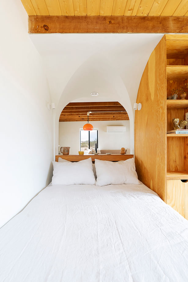 View of sleeping nook nestled inside vaulted form