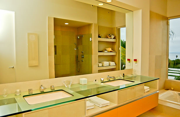 Master bathroom features waterjet cut glass top.