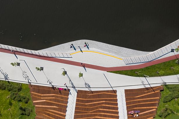 The design and functions of the embankment in Pavshinskaya Poyma are determined by the context.