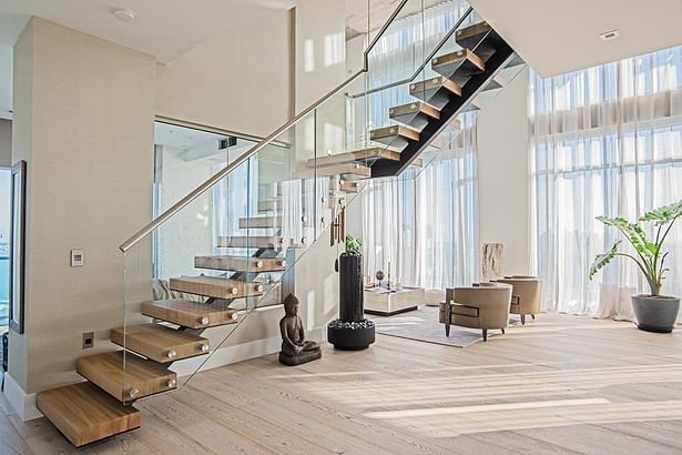 Glass railings are side mounted using stainless steel standoffs.