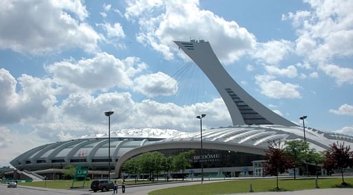 The Montreal Olympic Stadium ranks #1 in percentage over-budget, overtaking the initial estimate by nearly 2000%. Image via Wikipedia.