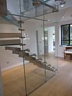 Glass stairs, glass facade, glass floor and entrance portal, design by Siller