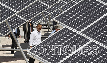 President Barack Obama inspects the solar panels at Nellis Air Force Base in Las Vegas. Photo by Charles Dharapak / AP) 