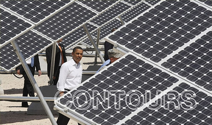 President Barack Obama inspects the solar panels at Nellis Air Force Base in Las Vegas. Photo by Charles Dharapak / AP) 