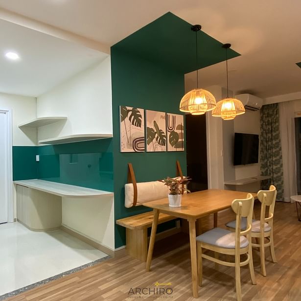 Kitchen and Dining Area To accommodate the wife’s passion for cooking, additional open kitchen cabinets were installed, optimizing storage while maintaining aesthetics. A dining table with a wall-mounted bench and two movable chairs saves space and creates a play area for their child. Living Room A light gray L-shaped sofa serves as a cozy centerpiece for family movie nights. The layout ensures the room remains open and spacious for shared family activities.