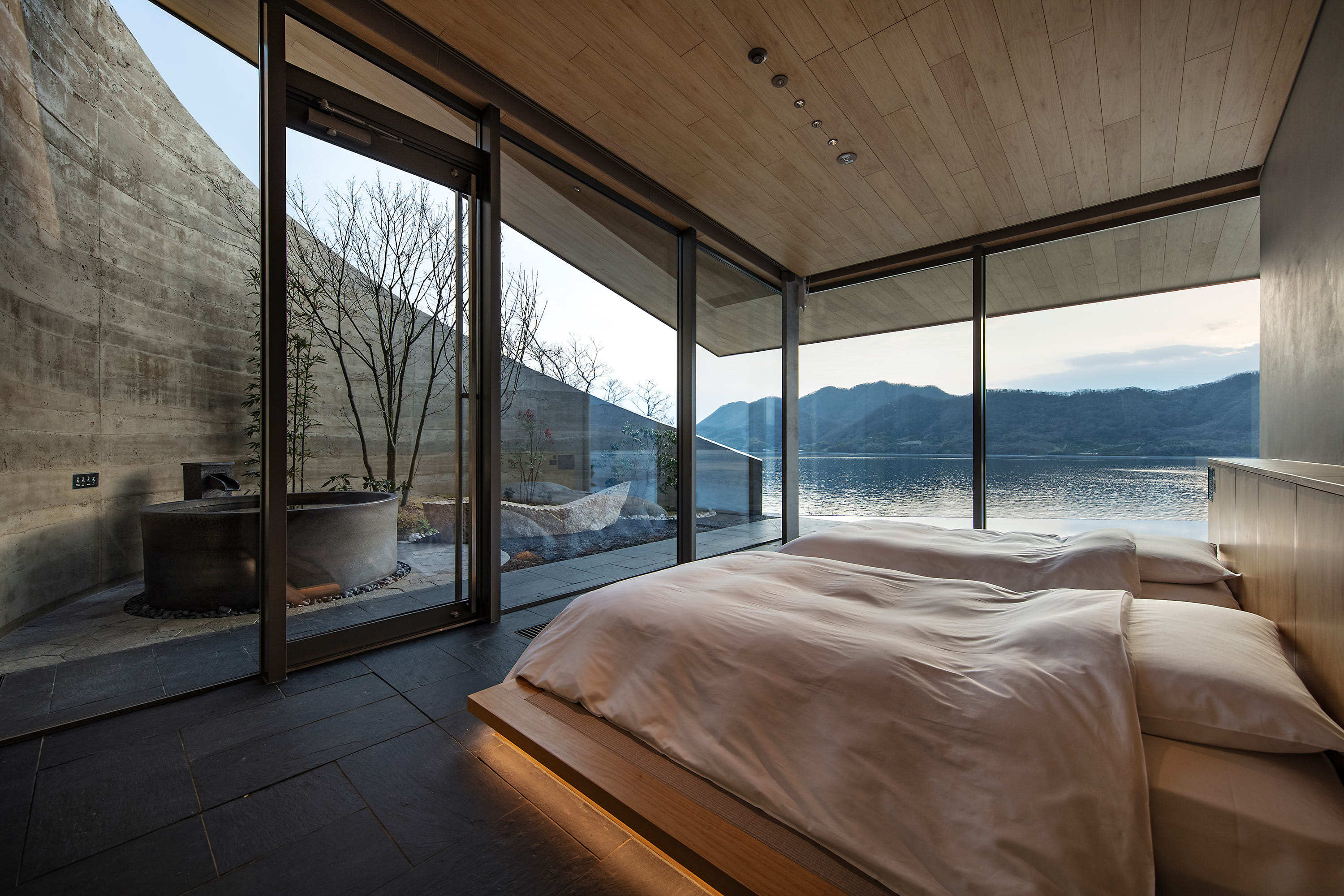 Island vistas and rammed earth star in BIG's Japanese NOT A HOTEL