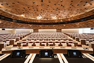 Designed by PEIA Associati, WOOD-SKIN covers UN assembly hall ceiling to resemble sand dune waves