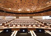 Designed by PEIA Associati, WOOD-SKIN covers UN assembly hall ceiling to resemble sand dune waves
