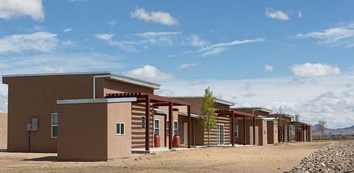 East view of Wa-Di Housing development down shared community space, looking towards the Cerrillos Hills. Photo Credit: AOS Architects
