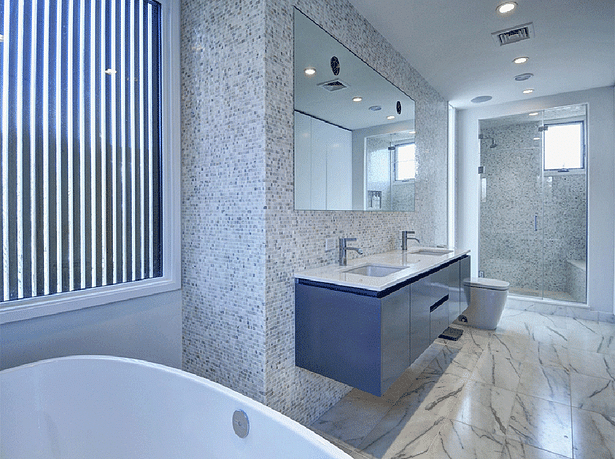 The bathroom features a large soaking tup and separate walk-in shower.