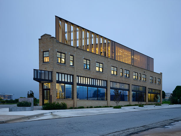 South elevation. At early dusk the building begins to glow. 
