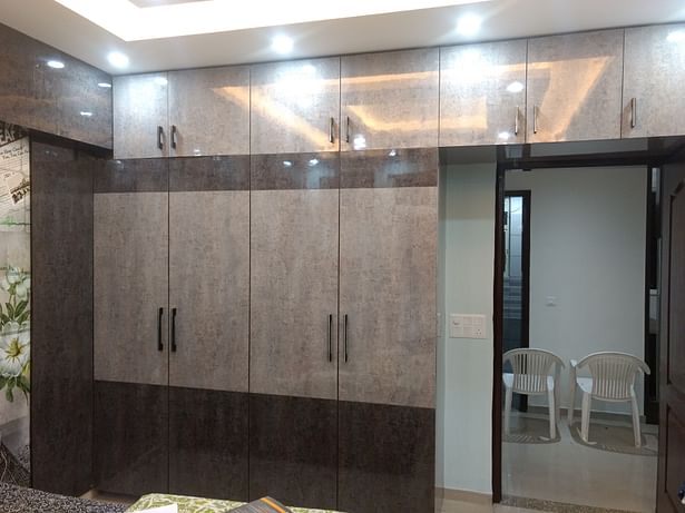 Trending Stylish Bedroom High gloss laminated Grey wooden Sliding modular wardrobe by Aspire Interiors, Interior service providers, manufacturers, retailers in Faridabad, Gurgaon Delhi NCR