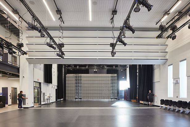 A folding partition in the multipurpose space opens to the black box theatre which extends the space to accommodate the entire student body.