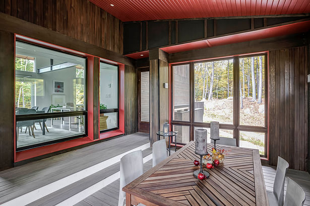 Screened in porch_looking towards the dining room and living room_south_and the landscape_west