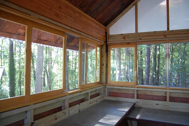 Interior of the husbandry shed's smaller volume, with custom built windows and countertops.