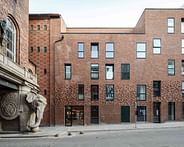 ADEPT adds timeless brickwork facade to historic Carlsberg Brewery in Copenhagen