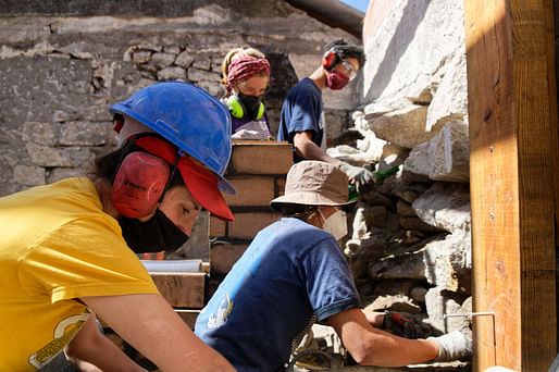 Students and mentors getting hands-on construction experience on site