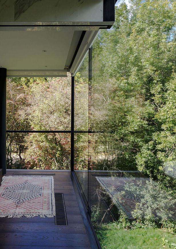 Every room boosts two glass walls, allowing the light to flow freely throughout the property. Image by mariashot.photo 