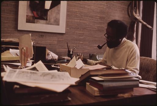 Photograph of Ebony editor Lerone Bennett working in his office at the Johnson Publishing Company headquarters. Image courtesy of John H. White.