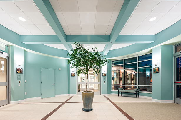 A bright lobby leads to the fitness center, as well as connects to the Corpening residence building.