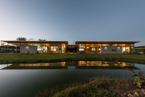 Inchyra is comprised of two wings separated by a dog trot entry. The wing to the right is general living space. To the left: guest room exercise, shop and garage. This facade faces south toward a national forest. An aquaculture pond is in the foreground. photo: Fredrik Brauer Fredrik Brauer
